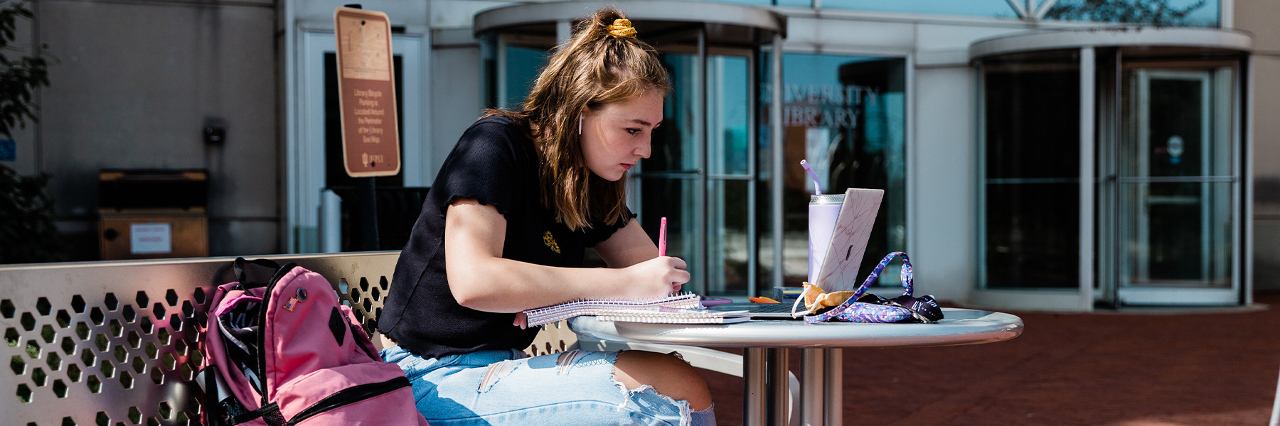 Student doing school work outside