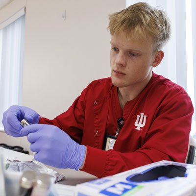 An IU School of Nursing student volunteers during a regional clinic.